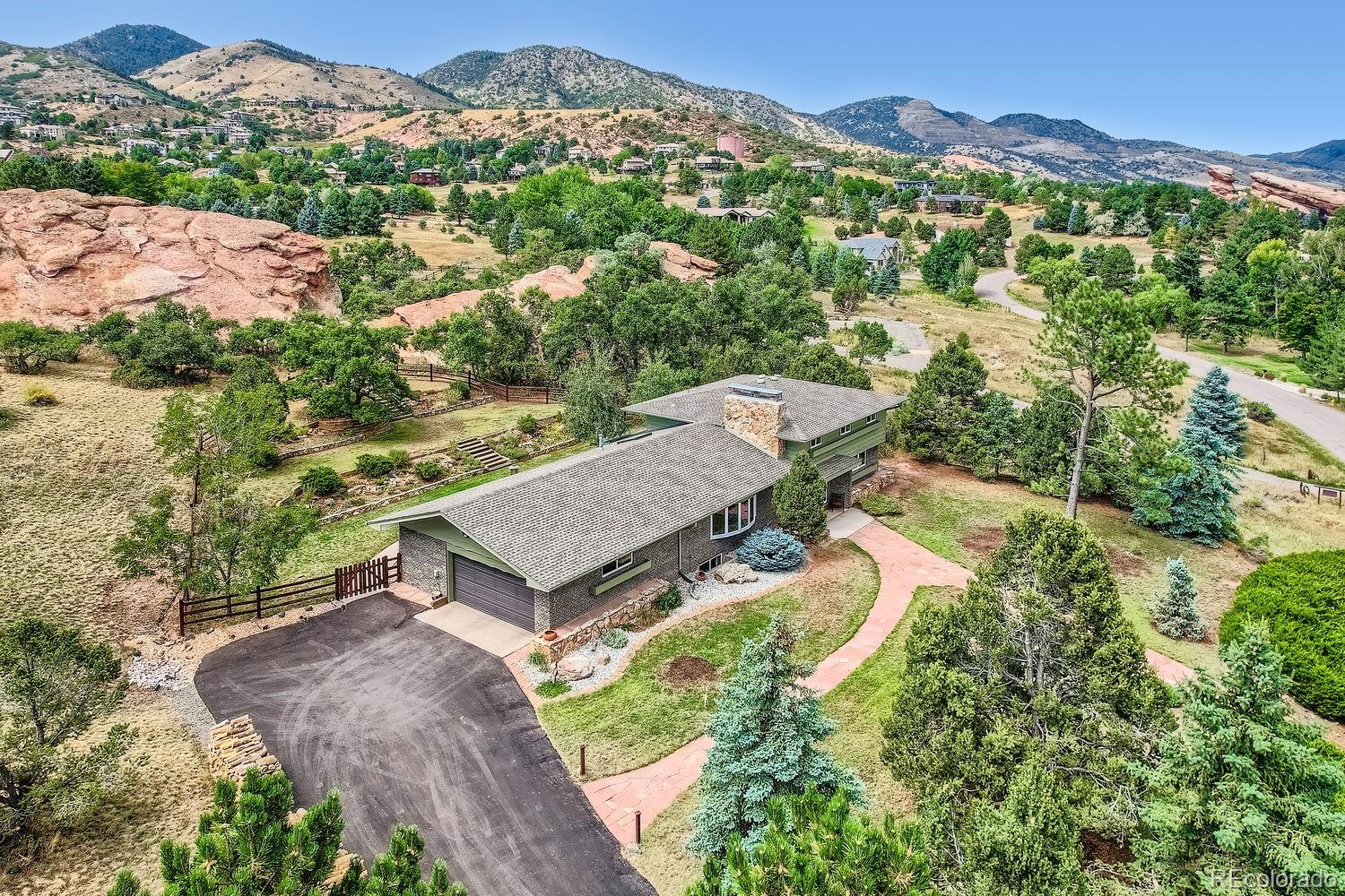 6227 Colorow Drive Morrison, CO 80465 - Photo 2 of 43 an aerial view of a house with a mountain