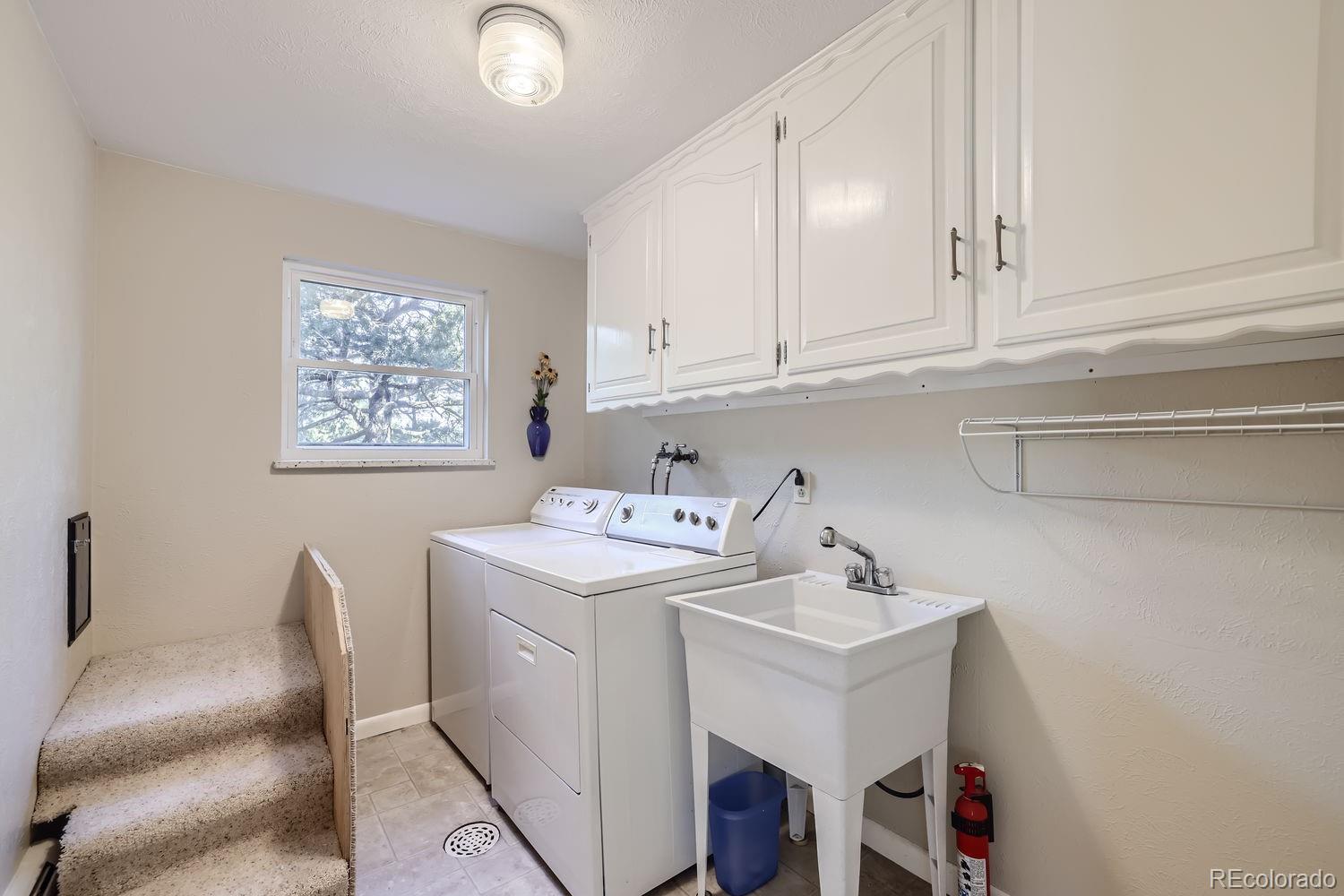 6227 Colorow Drive Morrison, CO 80465 - Photo 26 of 43 a utility room with dryer and washer