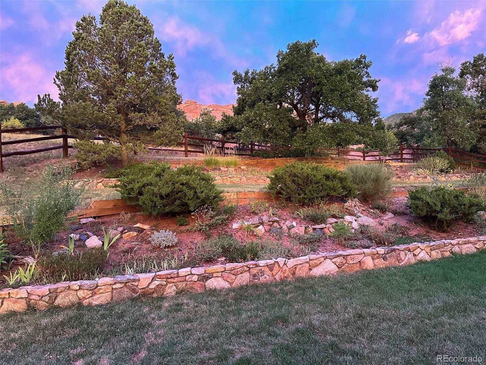 6227 Colorow Drive Morrison, CO 80465 - Photo 38 of 43 a view of a lake with a yard