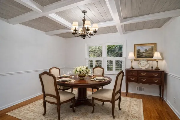 a view of an entryway with wooden floor