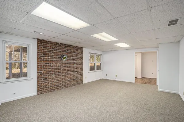a view of room with wooden floor