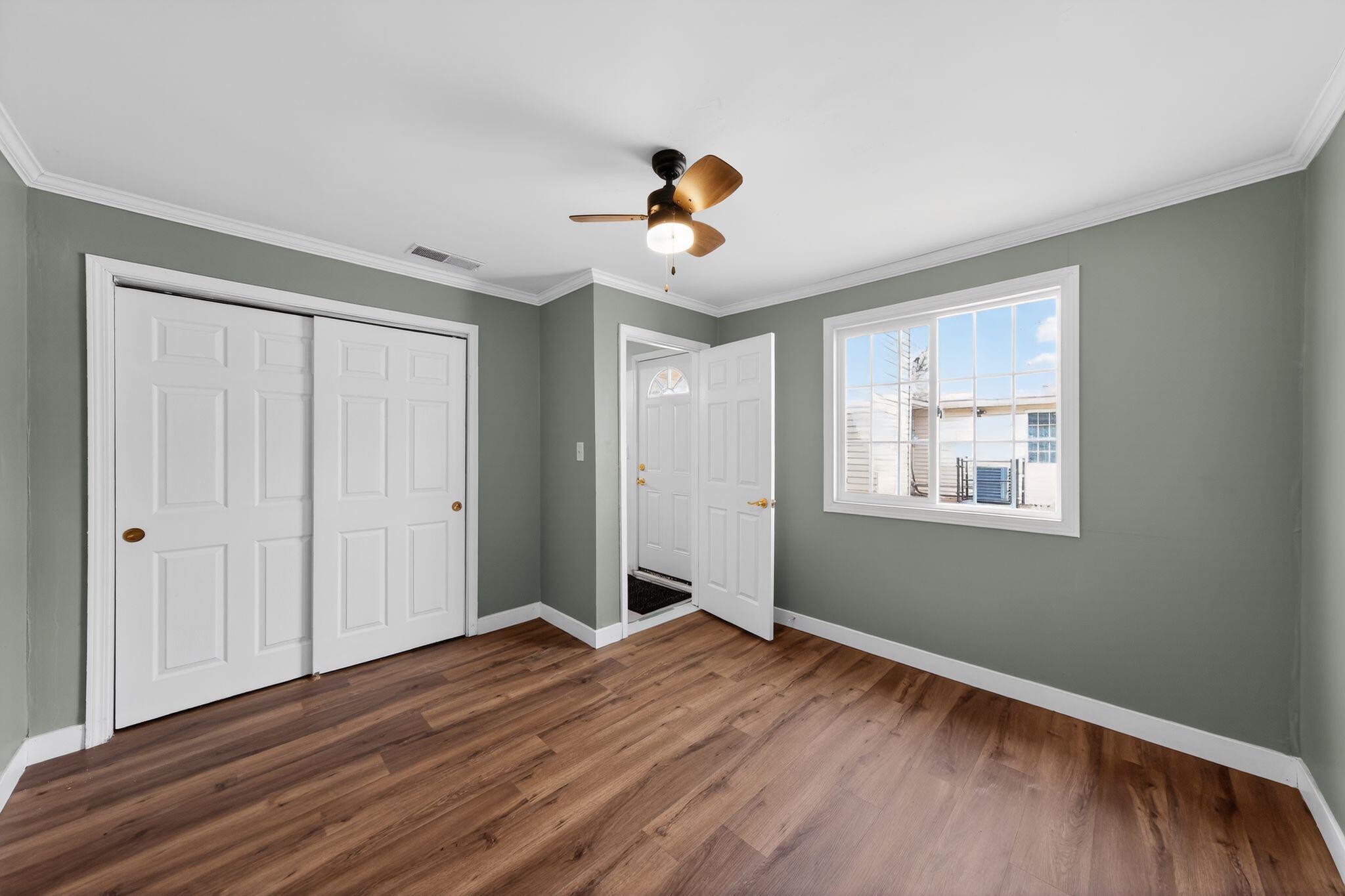 1908 Central Drive Gary, IN 46407 - Photo 13 of 29 a view of an empty room with wooden floor and a window