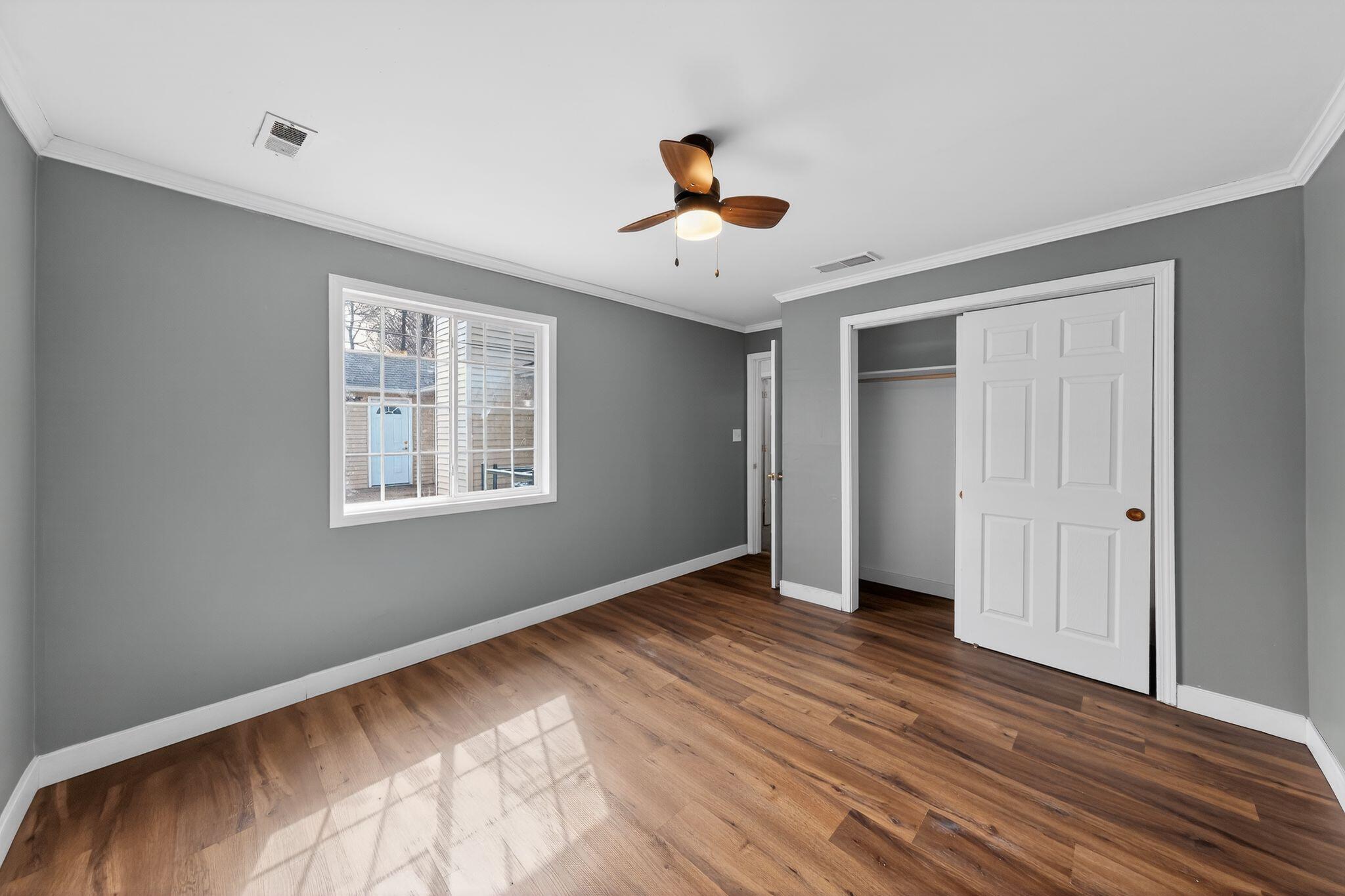 1908 Central Drive Gary, IN 46407 - Photo 14 of 29 a view of an empty room with wooden floor and a window