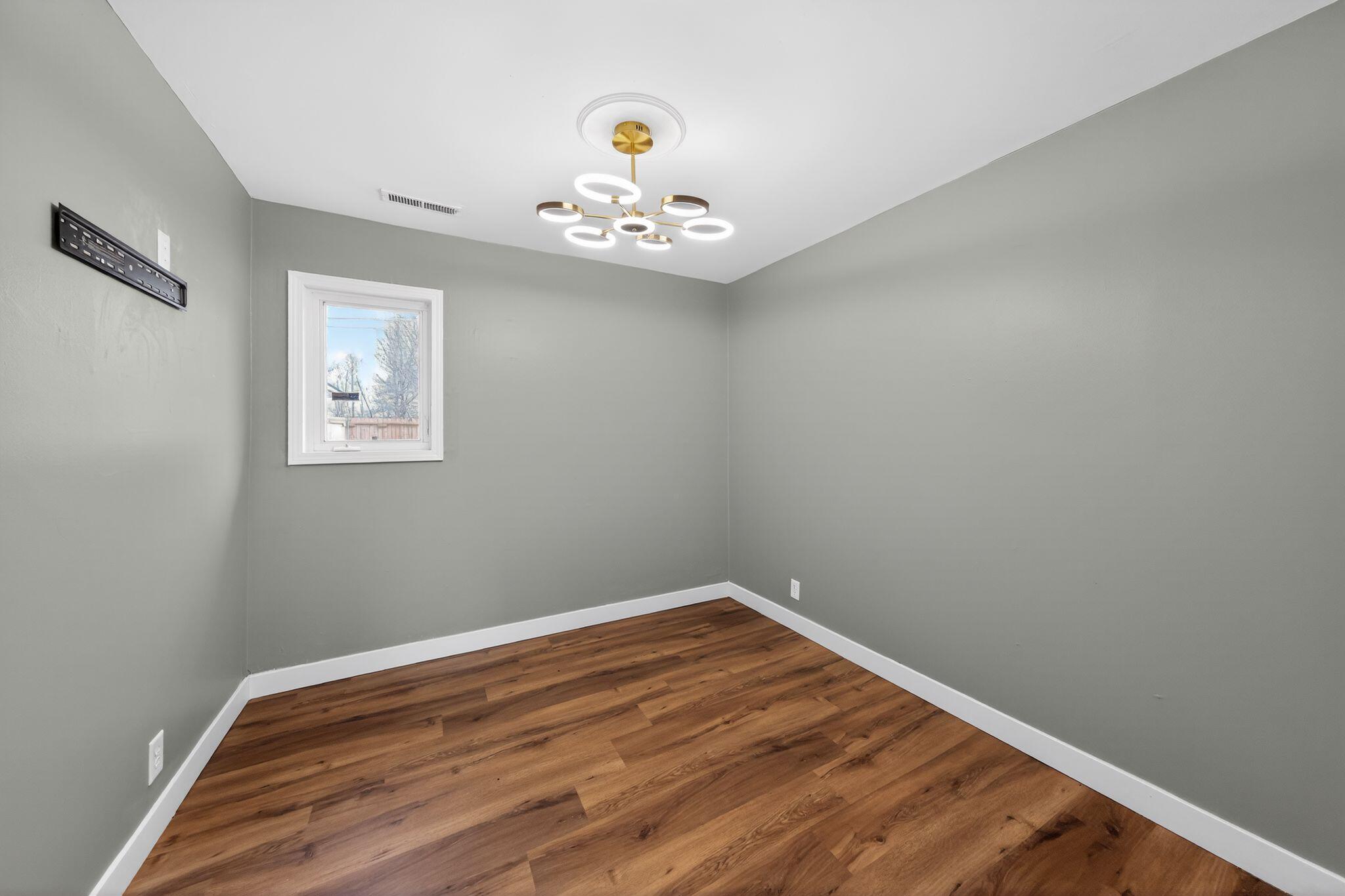 1908 Central Drive Gary, IN 46407 - Photo 18 of 29 a view of wooden floor and chandelier in a room