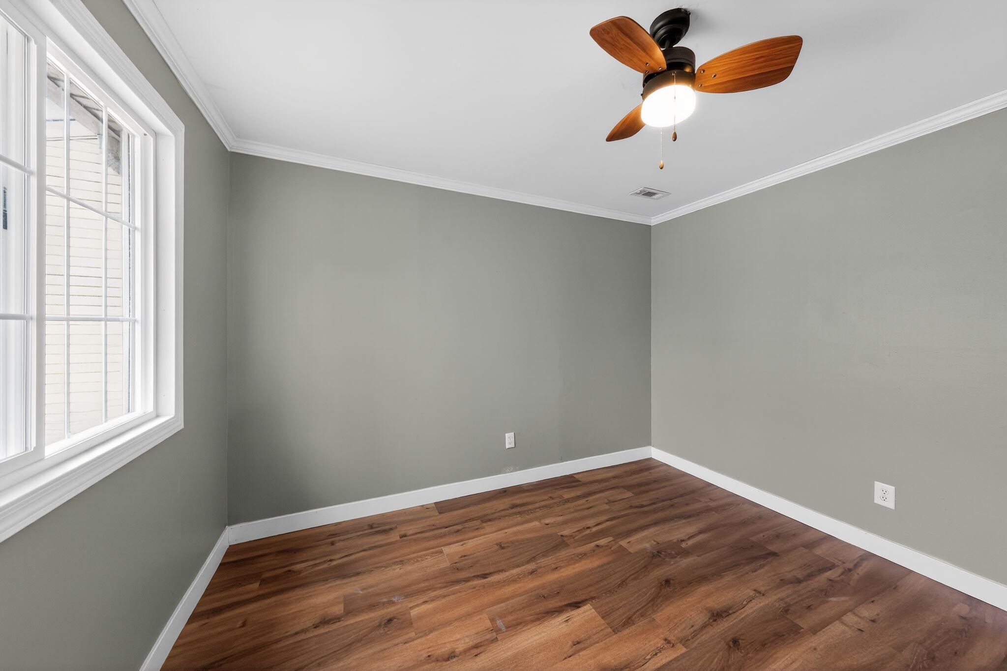 1908 Central Drive Gary, IN 46407 - Photo 19 of 29 wooden floor in an empty room with a window