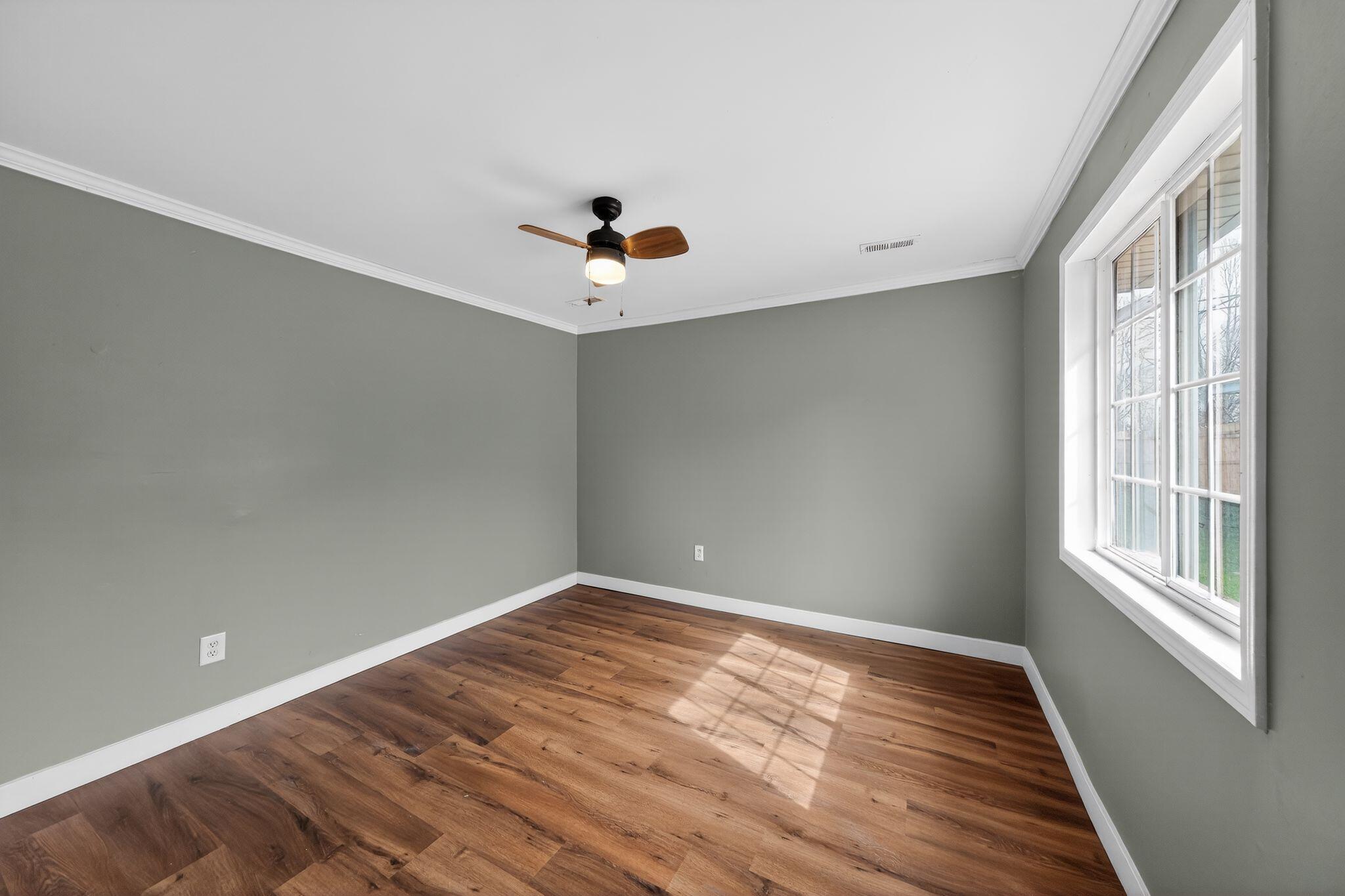 1908 Central Drive Gary, IN 46407 - Photo 20 of 29 a view of a room with wooden floor and fan