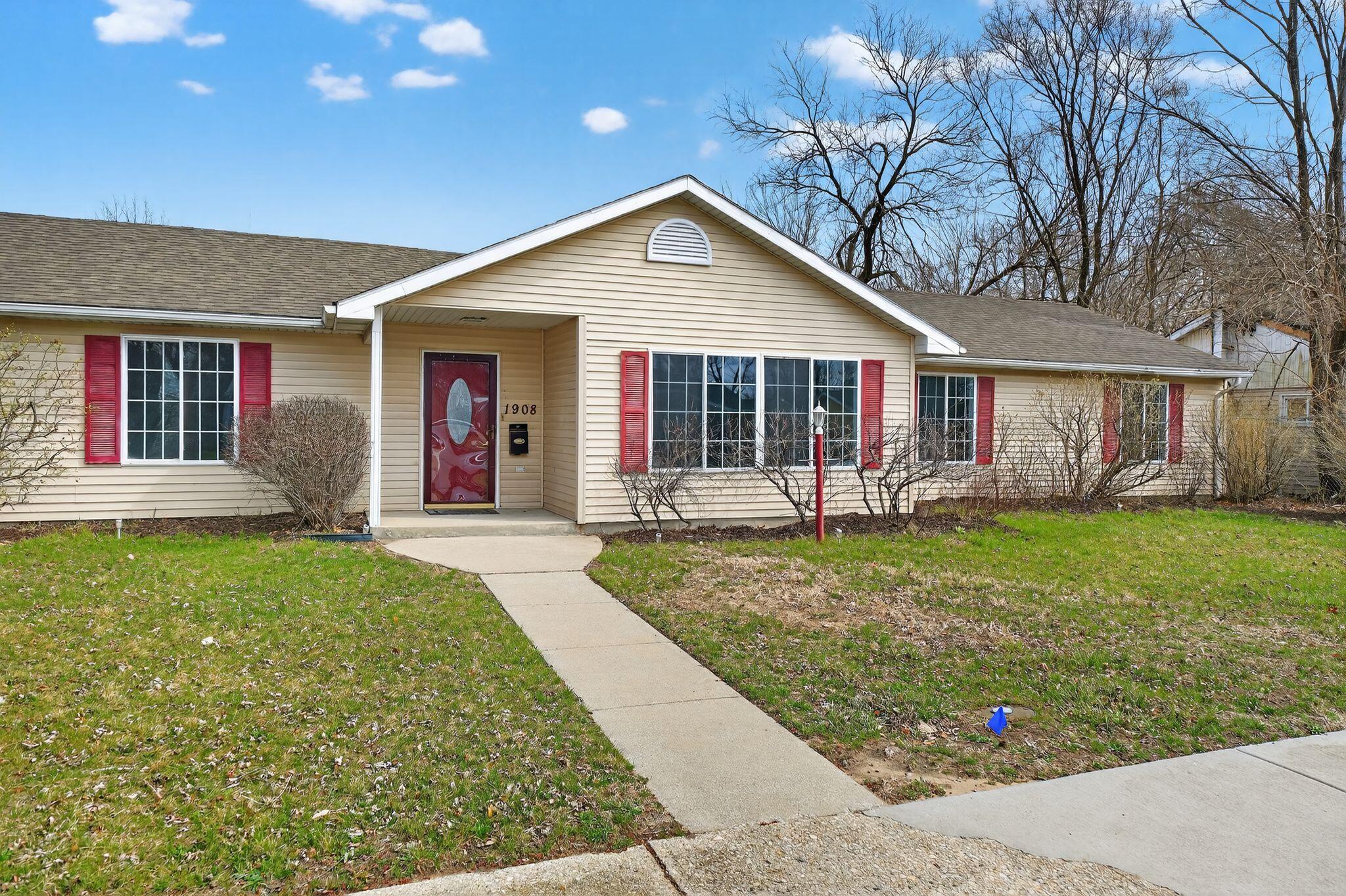 1908 Central Drive Gary, IN 46407 - Photo 2 of 29 a view of a house with a yard and potted plants