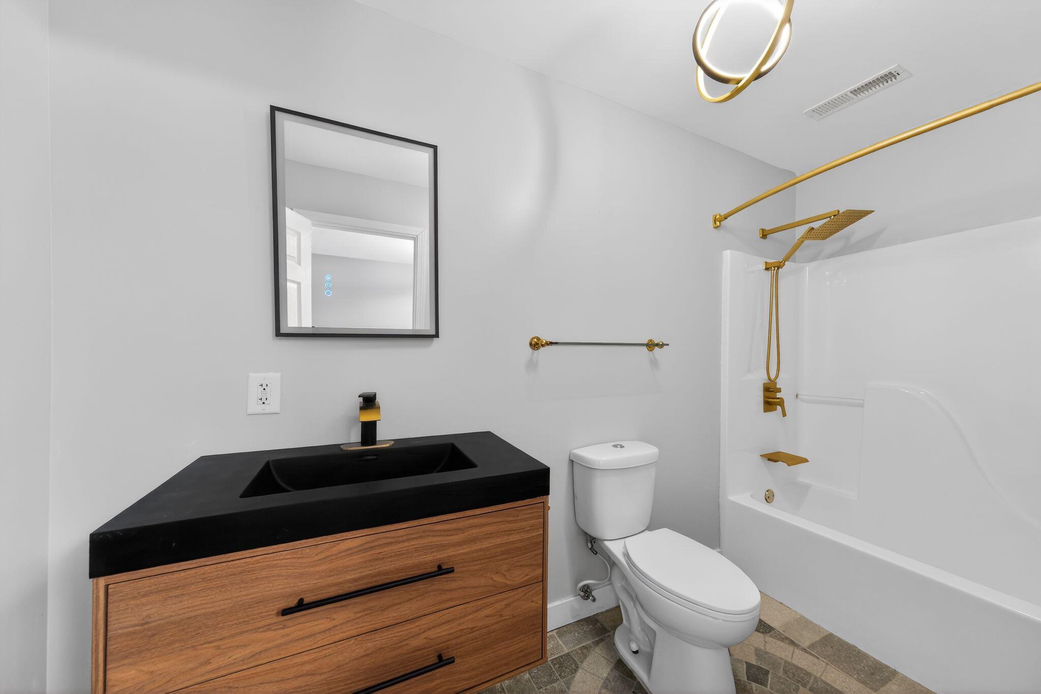 1908 Central Drive Gary, IN 46407 - Photo 24 of 29 a bathroom with a sink a toilet and shower