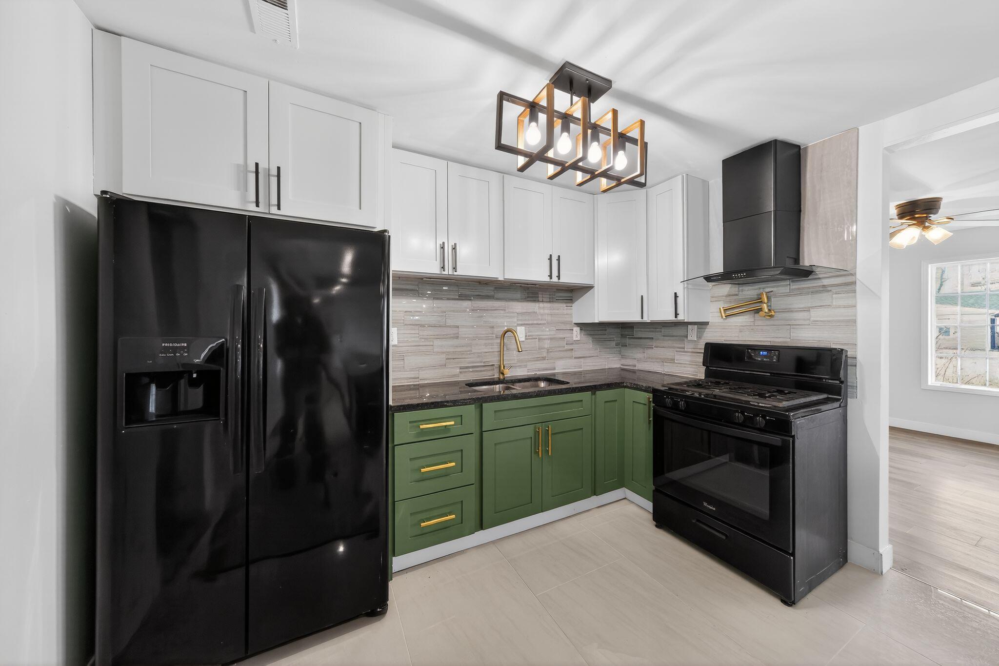 1908 Central Drive Gary, IN 46407 - Photo 9 of 29 a kitchen with cabinets and stainless steel appliances