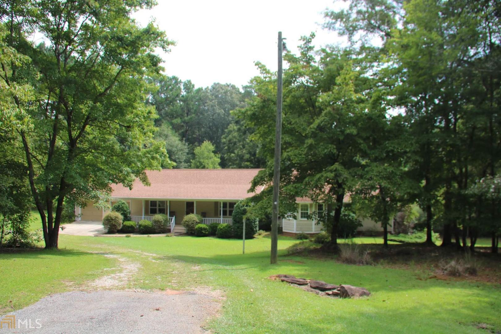 142 Allgood Road Newnan, GA 30263 - Photo 1 of 1 a view of a park with a large trees