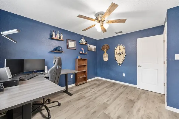 a view of a workspace with furniture