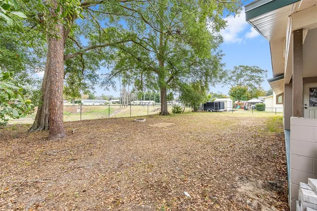 a view of open space with yard