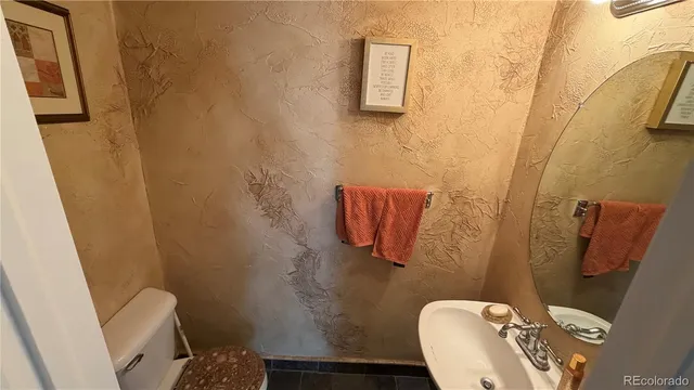 a bathroom with a toilet and a sink