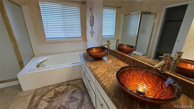 a bathroom with a tub and sink