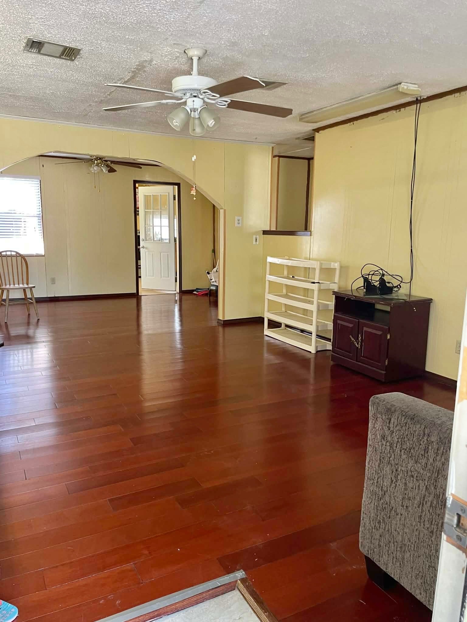 1825 Isom Street Houston, TX 77039 - Photo 13 of 27 a view of livingroom with furniture wooden floor and windows