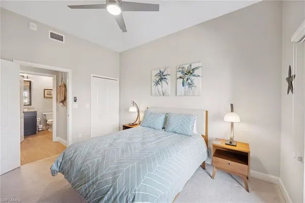 a bathroom with a granite countertop sink mirror and shower