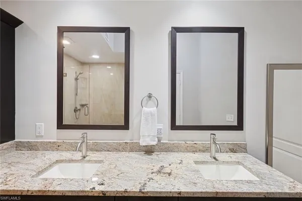 a bathroom with a toilet sink and shower