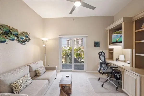 a bedroom with a bed and a television