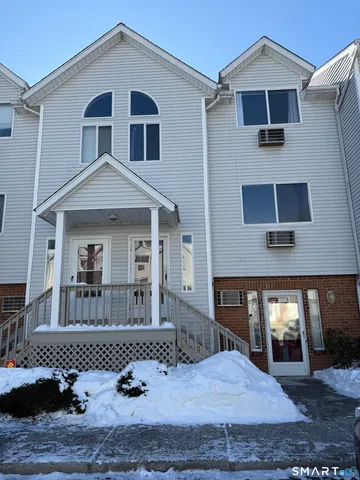 a front view of a house with garage
