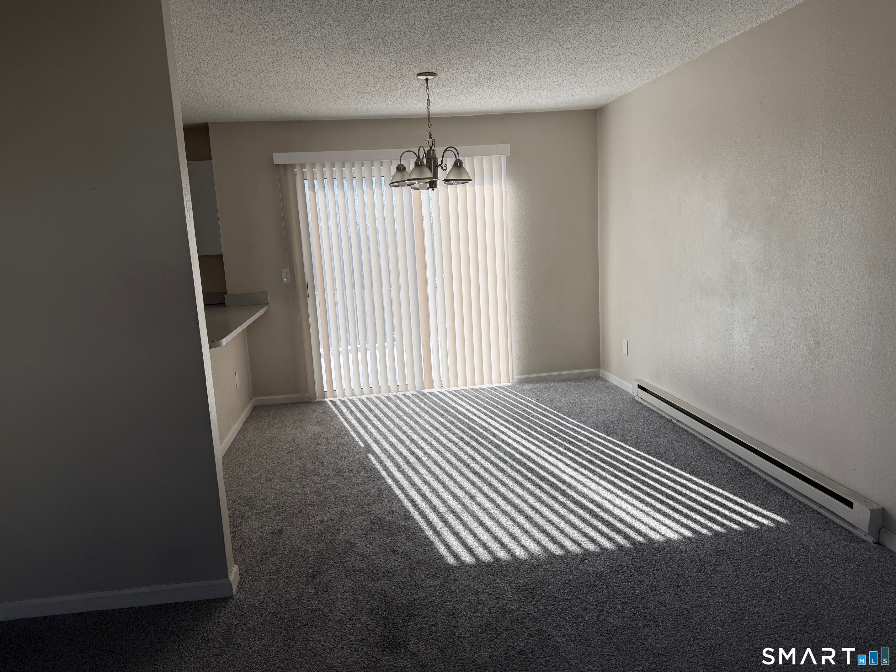 925 Oronoke Road, Unit 30F Waterbury, CT 06708 - Photo 4 of 12 an empty room with wooden floor and windows