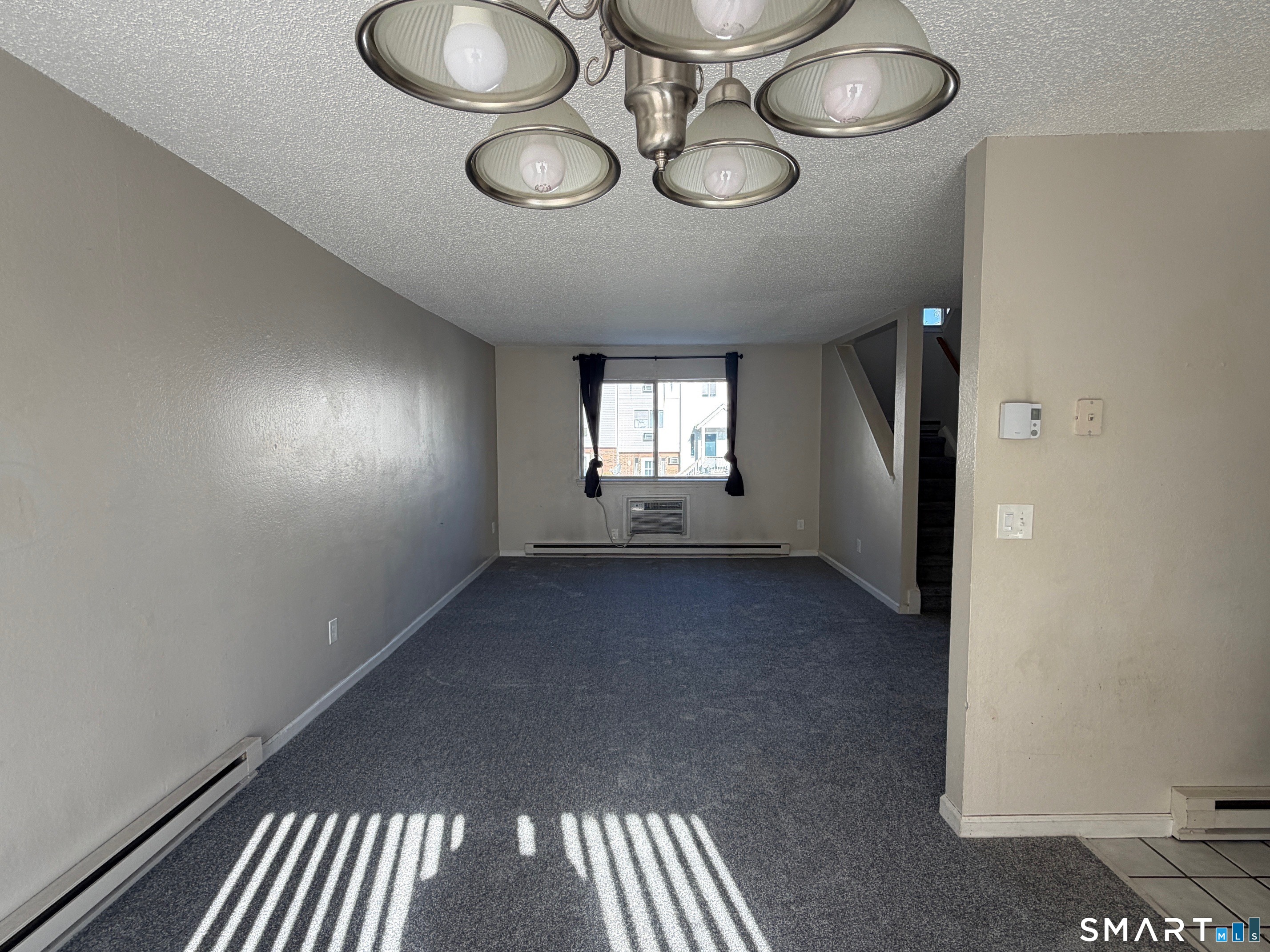 925 Oronoke Road, Unit 30F Waterbury, CT 06708 - Photo 6 of 12 a view of wooden floor and windows in a room