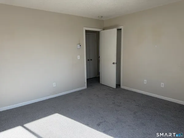 an empty room with a empty space and window