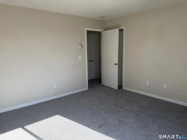 an empty room with a empty space and window