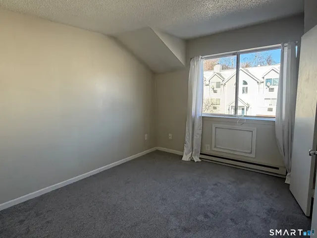 an empty room with a bathroom