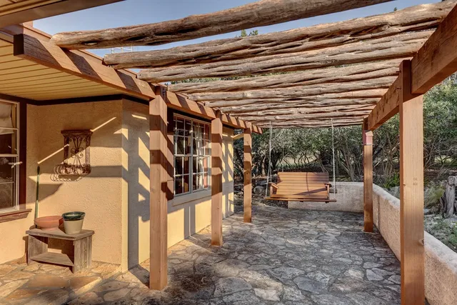 a view of a porch with seating space