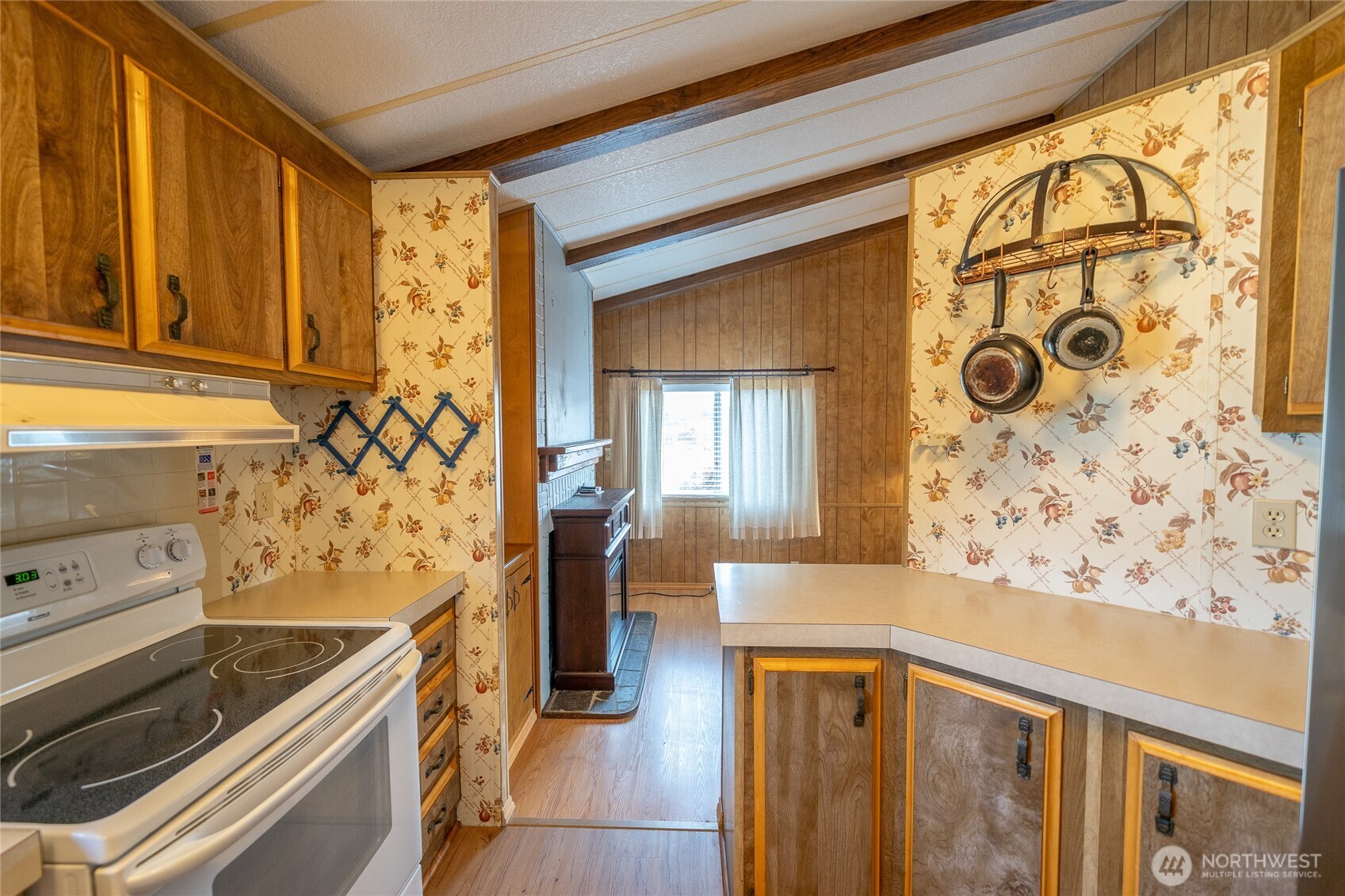 57 Clemons Road, Unit 68 Montesano, WA 98563 - Photo 11 of 27 a view of a kitchen with wooden floor and a window