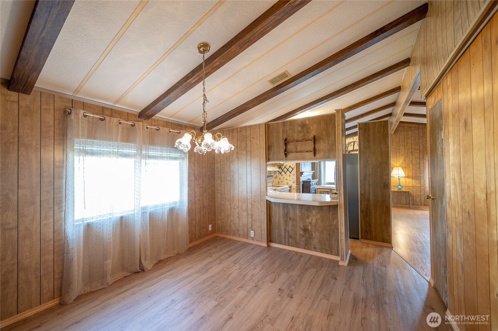 57 Clemons Road, Unit 68 Montesano, WA 98563 - Photo 12 of 27 an empty room with wooden floor and windows