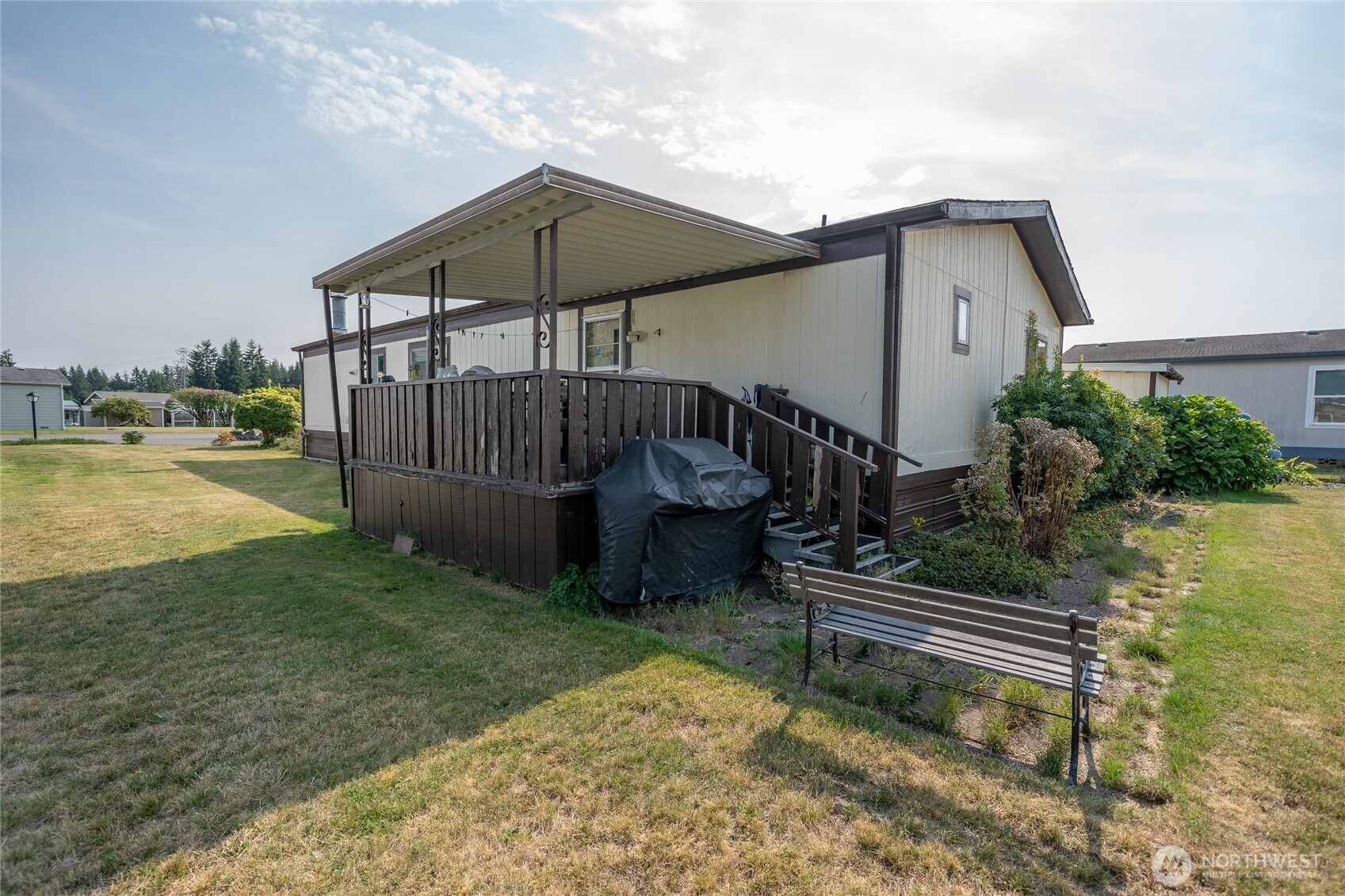 57 Clemons Road, Unit 68 Montesano, WA 98563 - Photo 27 of 27 a view of a chair and table in the backyard of the house