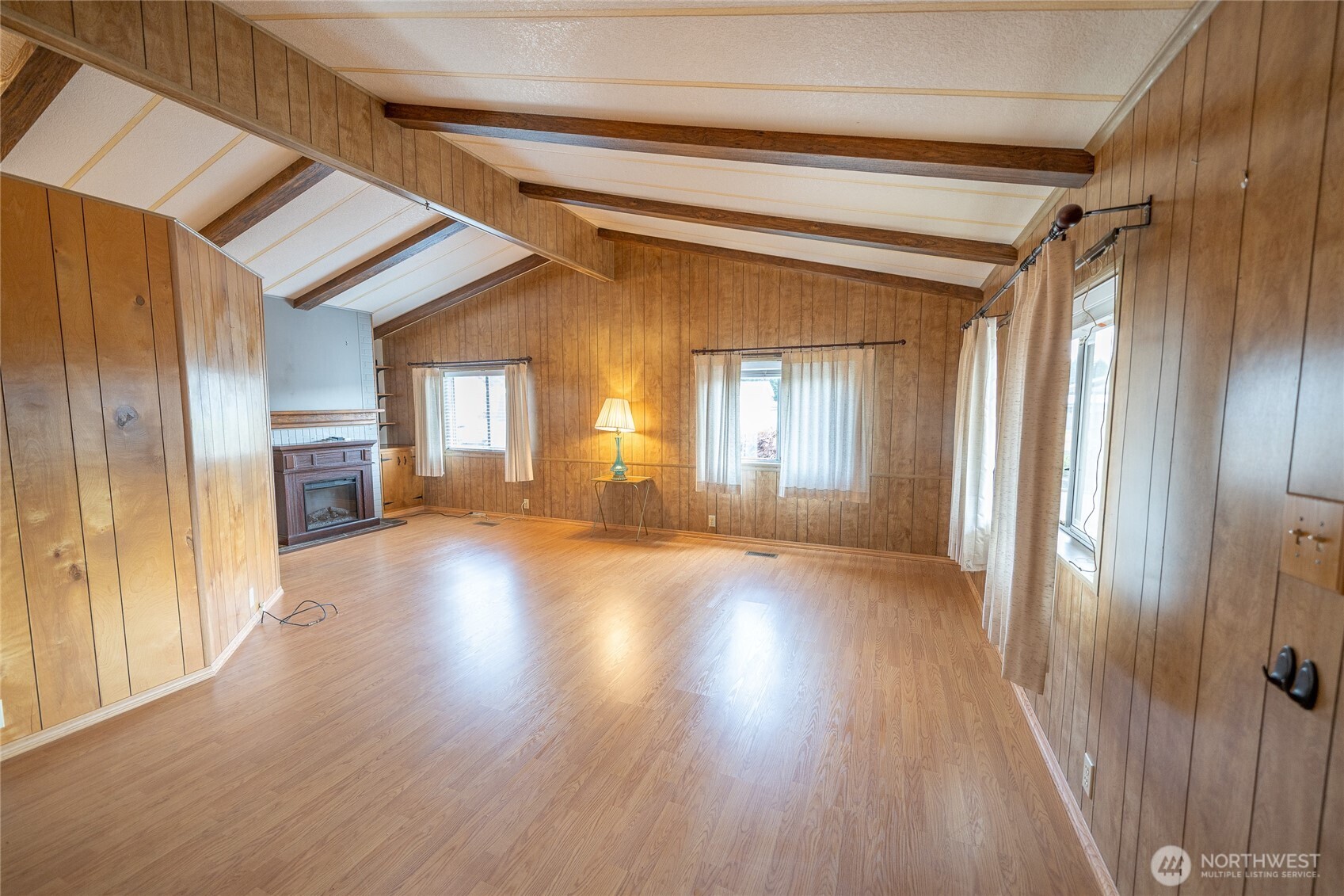 57 Clemons Road, Unit 68 Montesano, WA 98563 - Photo 4 of 27 a view of a big room with wooden floor and windows