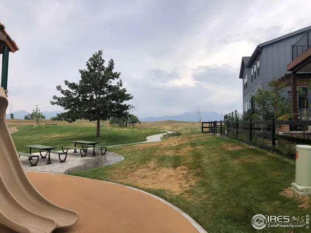 a view of a swimming pool with an outdoor space and seating area