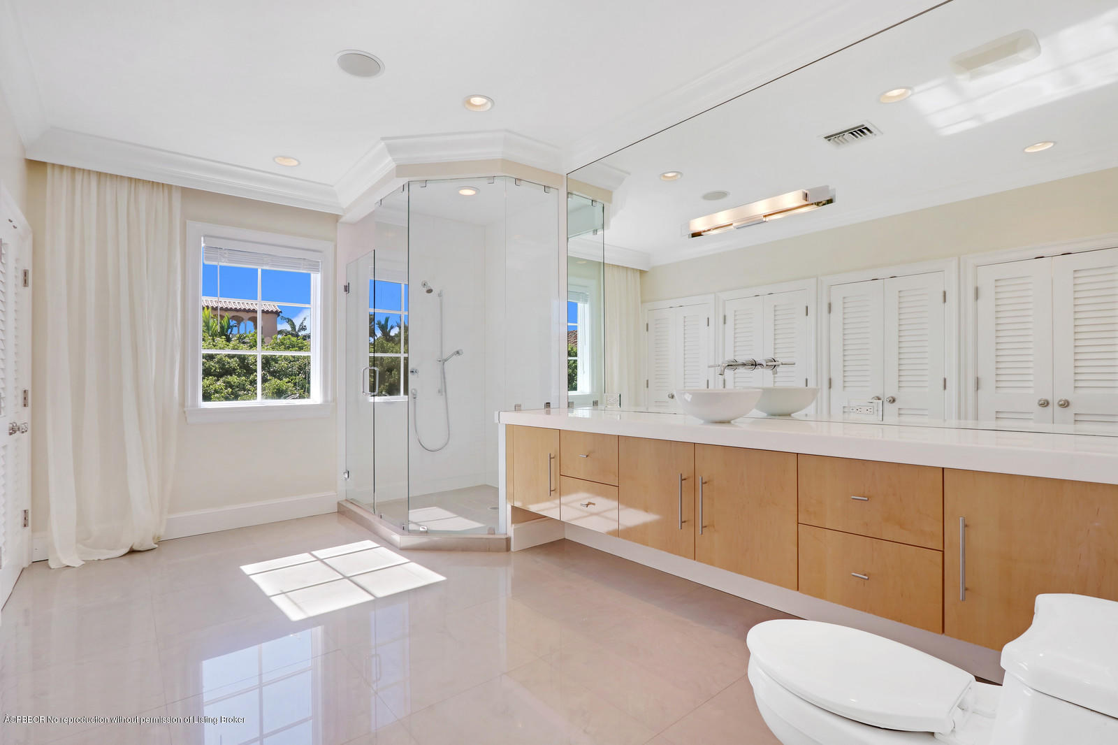 695 South County Road Palm Beach, FL 33480 - Photo 12 of 17 a bathroom with a double vanity sink toilet and shower