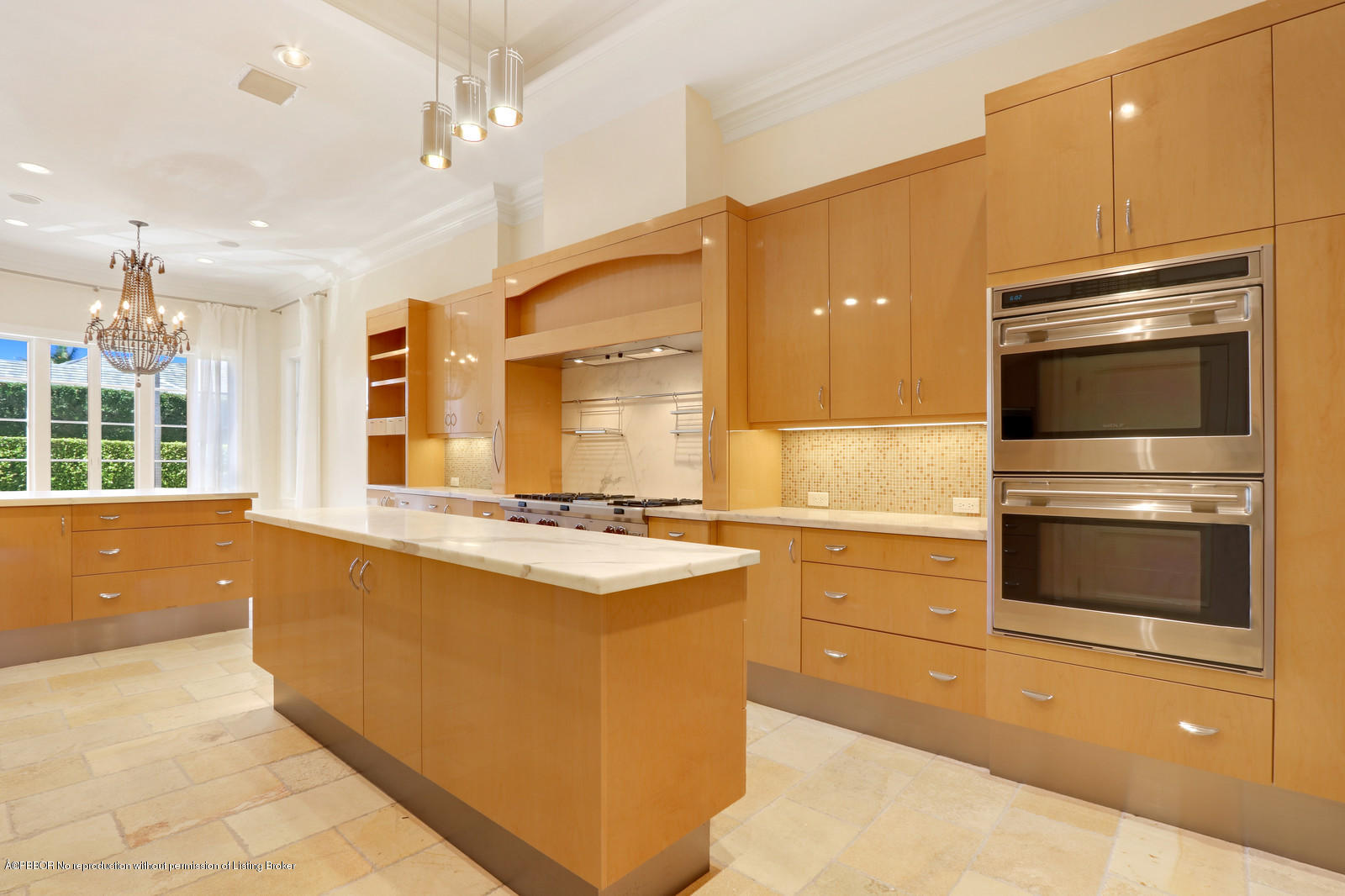 695 South County Road Palm Beach, FL 33480 - Photo 5 of 17 a kitchen with kitchen island a sink stainless steel appliances and cabinets