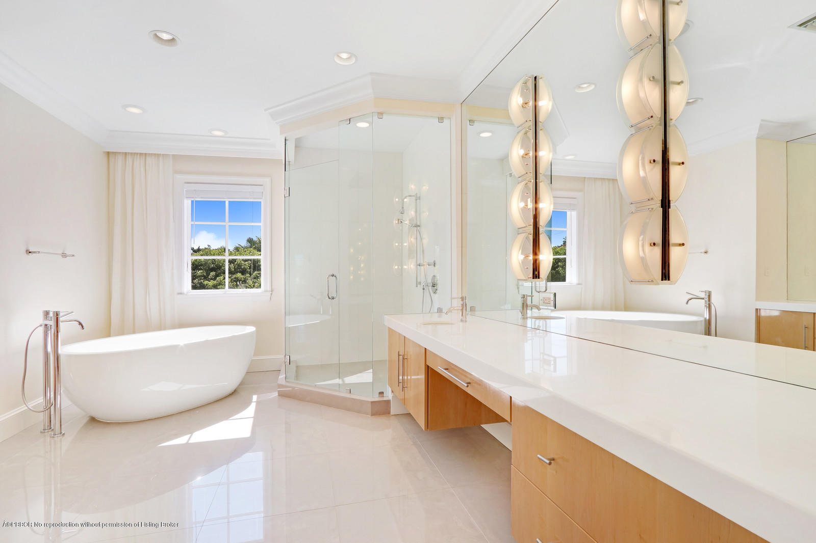 695 South County Road Palm Beach, FL 33480 - Photo 10 of 17 a bathroom with a tub a sink and a large mirror