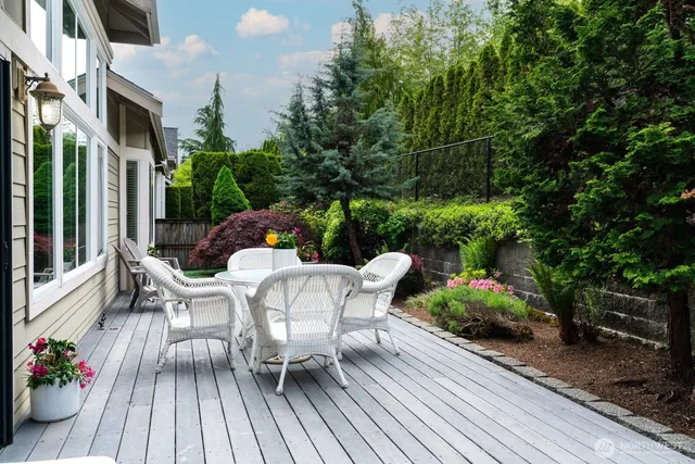 a view of a patio with table and chairs and potted plants