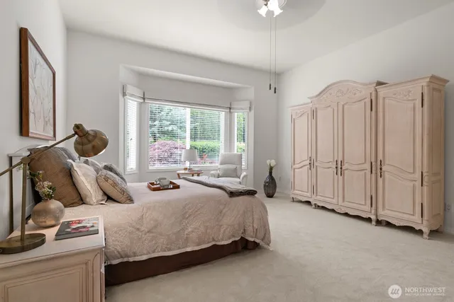 a bed room with a bed and a window