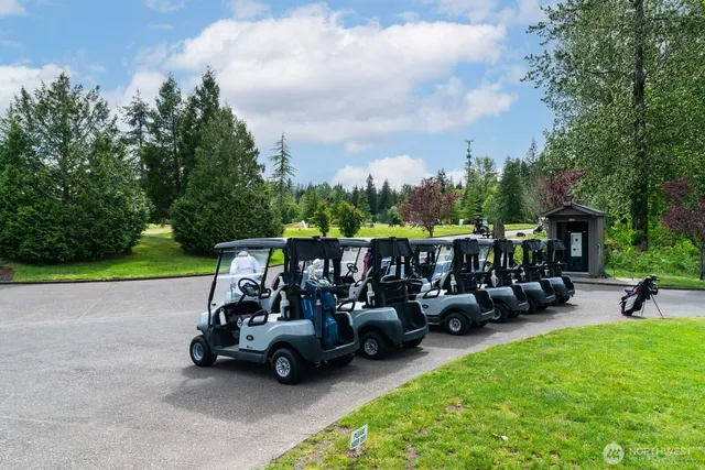 a view of a chair and tables in the back yard