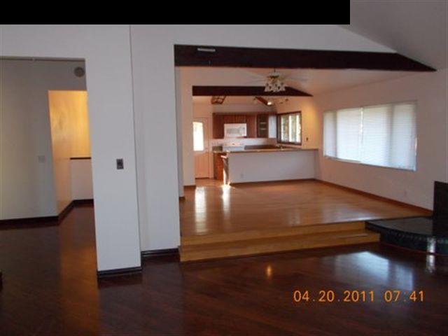 594 Naalae Road Kula, HI 96790 - Photo 13 of 14 a view of kitchen and hall with wooden floor