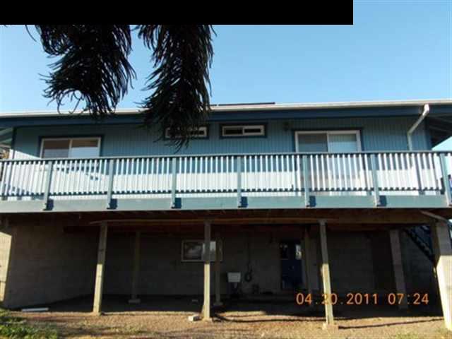 594 Naalae Road Kula, HI 96790 - Photo 4 of 14 a view of a house with a balcony