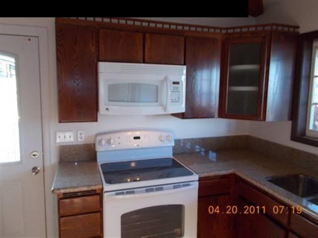 594 Naalae Road Kula, HI 96790 - Photo 7 of 14 a kitchen with a stove and a microwave