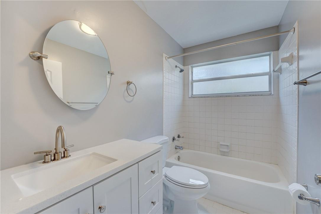 Undisclosed Address Davie, FL 33328 - Photo 19 of 24 a bathroom with a sink a toilet and shower