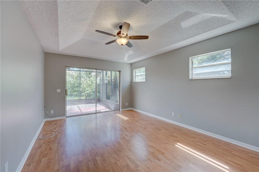 Undisclosed Address Davie, FL 33328 - Photo 20 of 24 a view of empty room with wooden floor and fan
