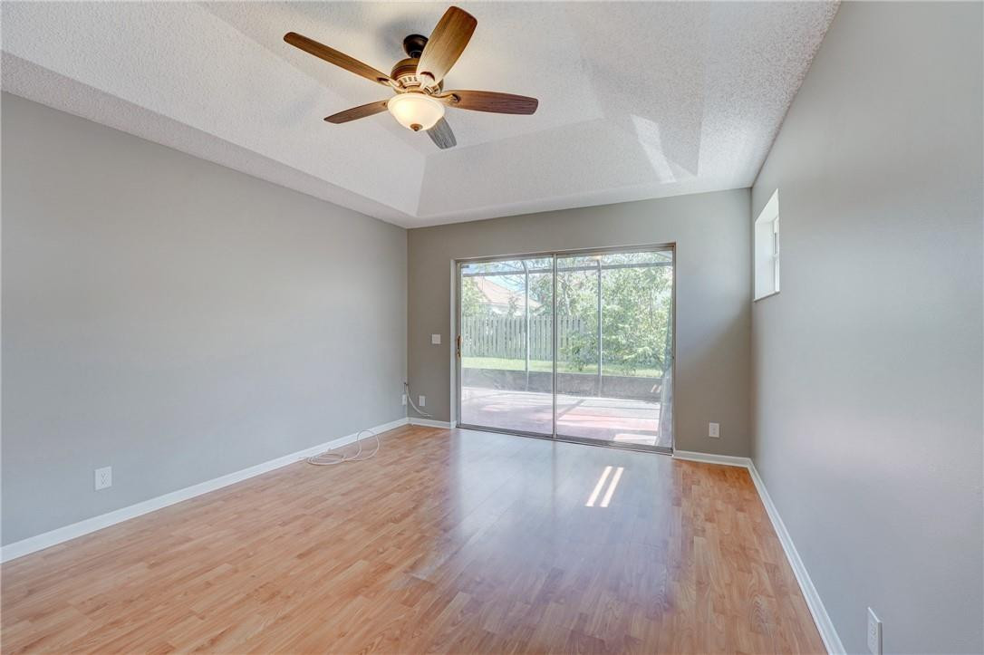 Undisclosed Address Davie, FL 33328 - Photo 21 of 24 an empty room with wooden floor and windows