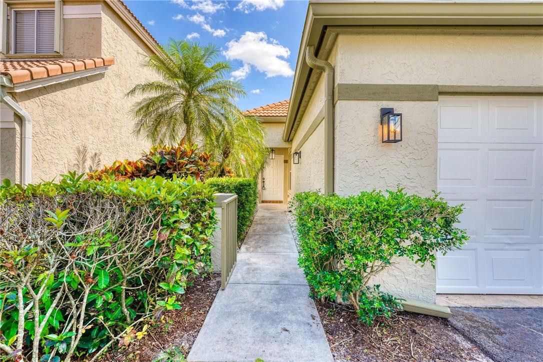 Undisclosed Address Davie, FL 33328 - Photo 3 of 24 a couple of potted plants in front of door