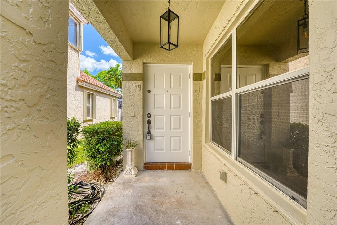 Undisclosed Address Davie, FL 33328 - Photo 4 of 24 a view of a entryway door front of house