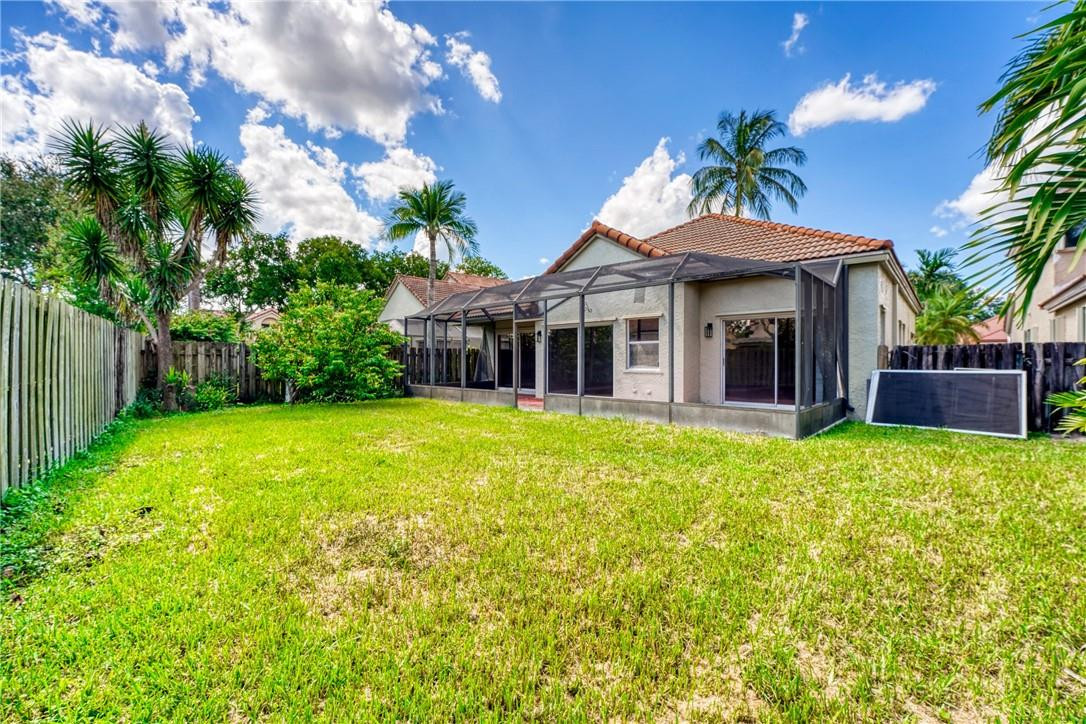 Undisclosed Address Davie, FL 33328 - Photo 5 of 24 a view of a house with a yard