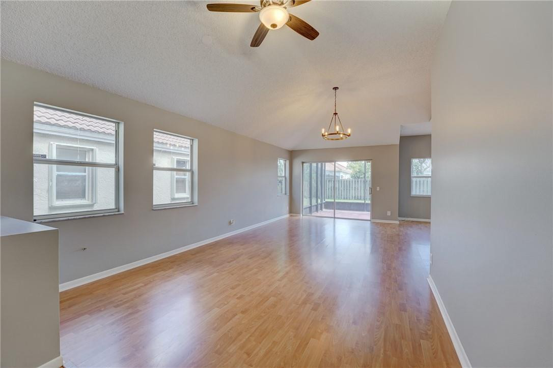 Undisclosed Address Davie, FL 33328 - Photo 8 of 24 a view of an empty room with wooden floor and a window